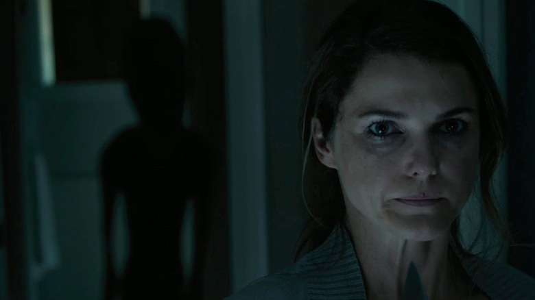 Lacy being stalked in "Dark Skies" (2013)