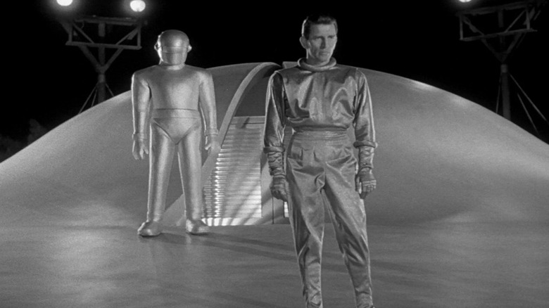 Klaatu and Gort stand atop their ship in "The Day the Earth Stood Still" (1951)