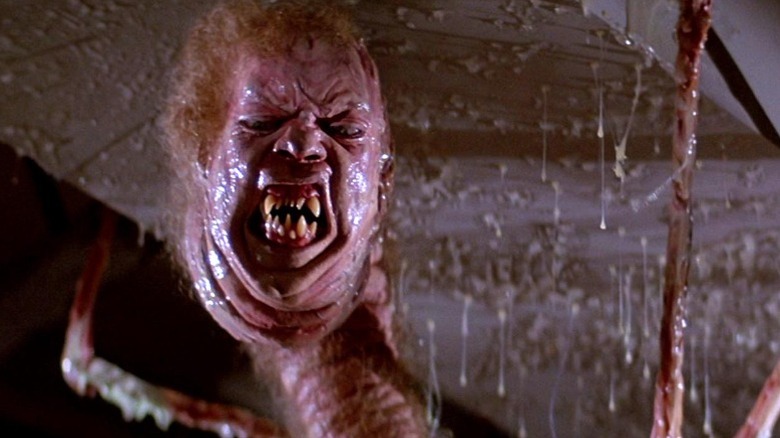 The Thing crawls up a ceiling in "The Thing" (1982)