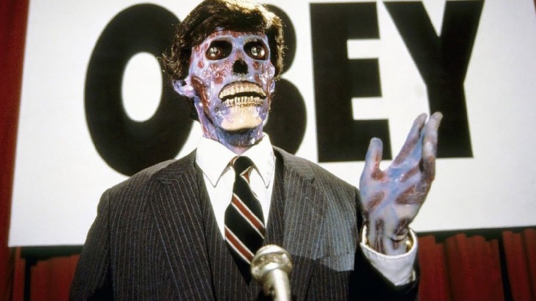 An alien disguised as a human speaks in "They Live" (1988)