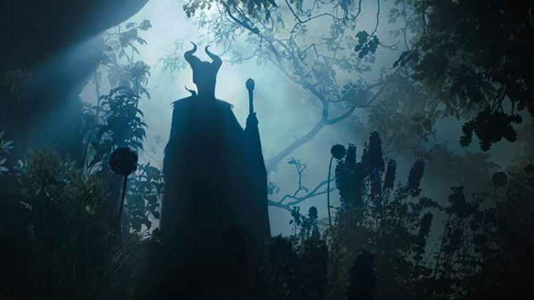 Maleficent stands sihlouetted