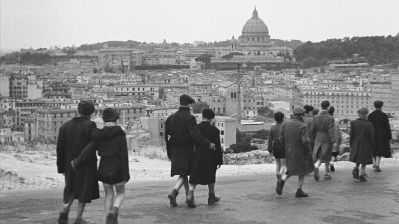 People walking through ruined Rome