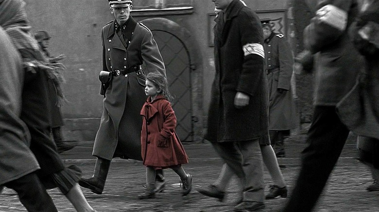 German soldier walking with prisoners