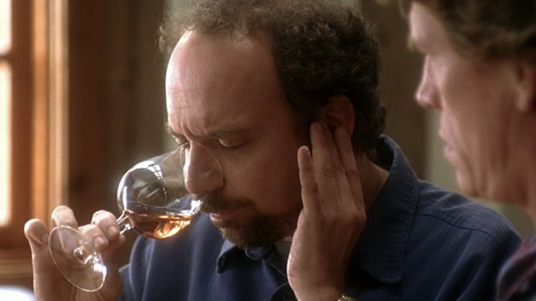 Paul Giamatti sniffs wine