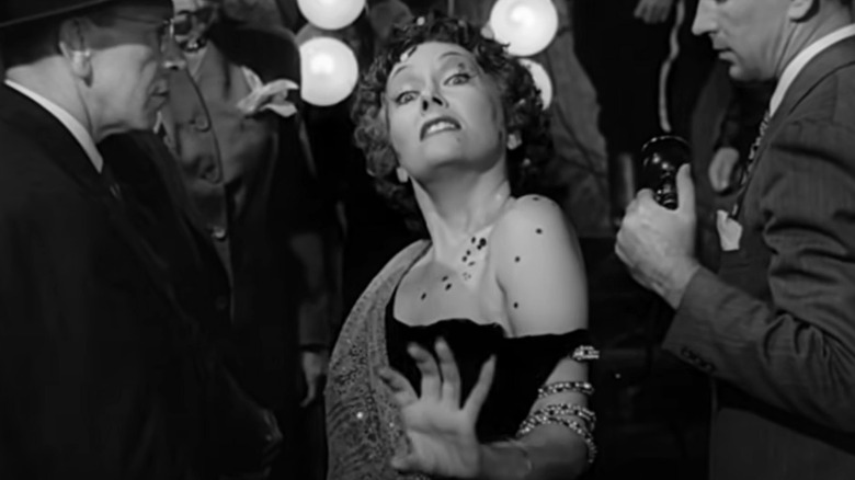 Norma Desmond walks through crowd