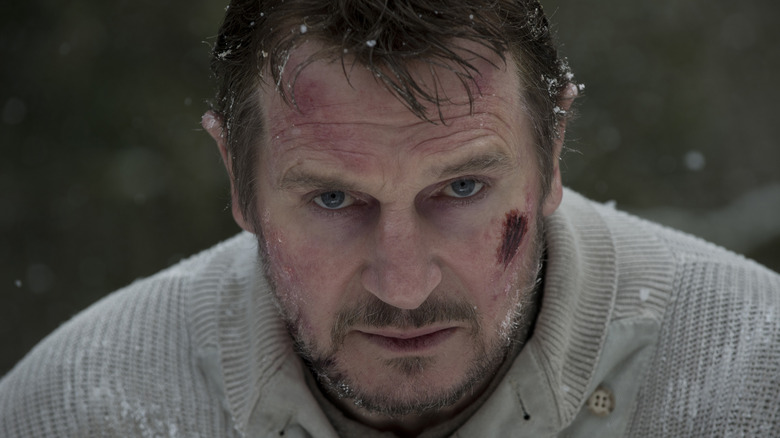 Liam Neeson glaring at wolves