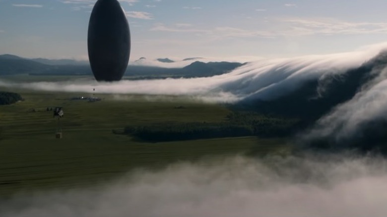 Arrival spaceship hovering over field