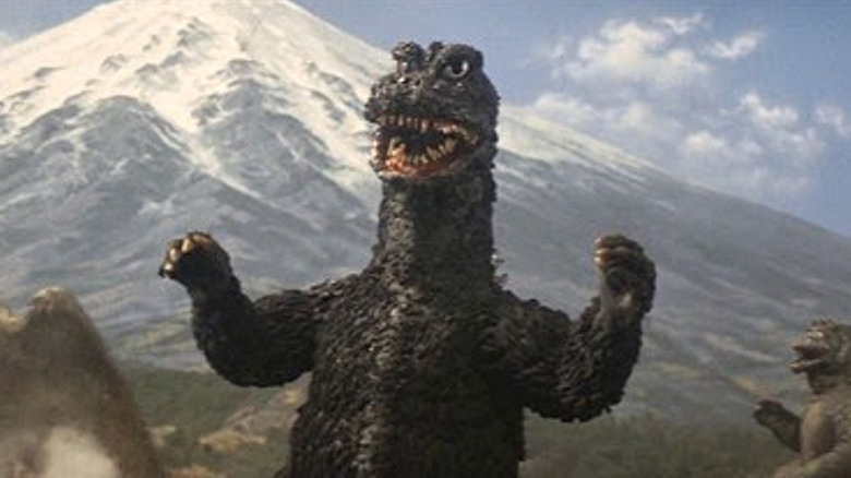 Godzilla roaring near mountain