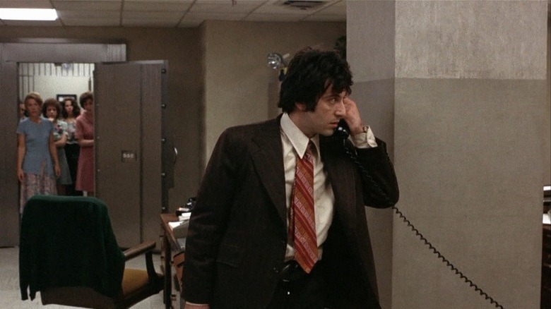 Sonny Wortzik on the phone in the bank