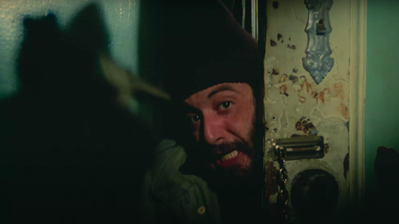 Serpico peeking from behind door