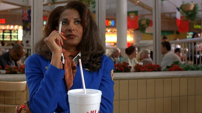 Jackie Brown smoking in food court