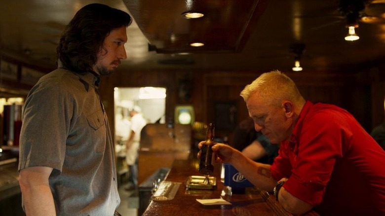 Clyde Logan tends bar in front of Joe Bang