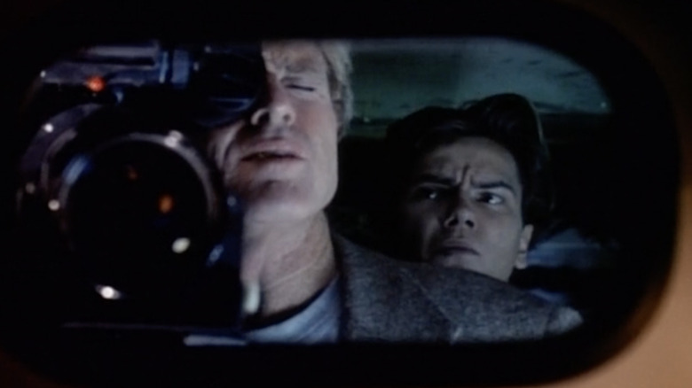 Martin Bishop and Carl Arbogast do surveillance