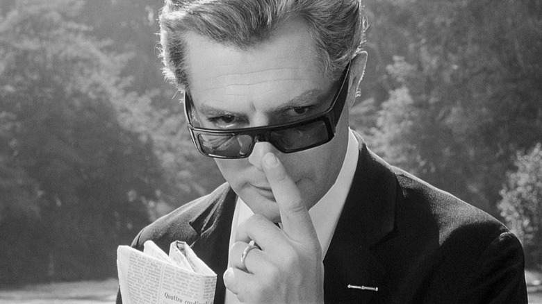 Guido Anselmi adjusts sunglasses