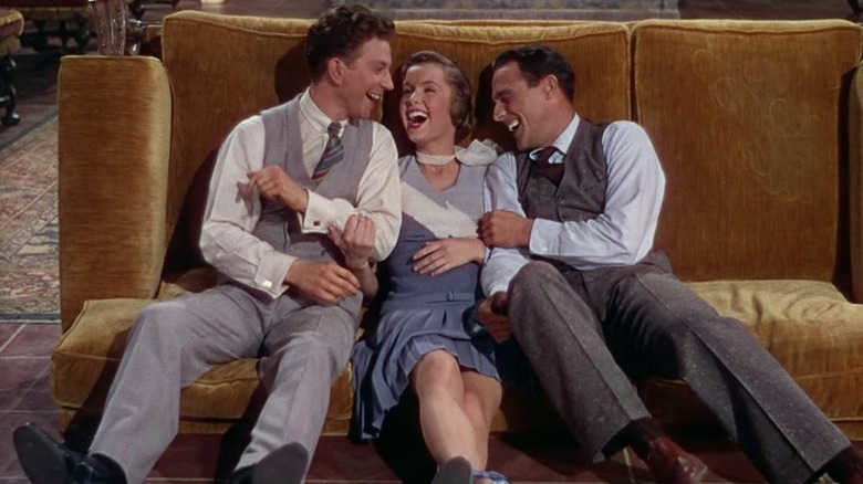 Don Lockwood, Kathy Selden, and Cosmo Brown laughing together