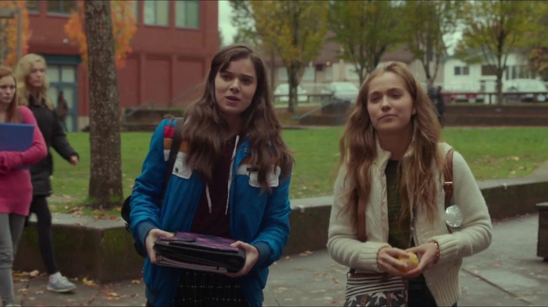 Nadine and Krista talk outside school