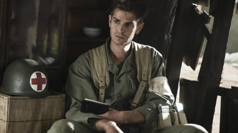 Desmond Doss sitting in camp