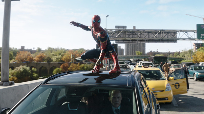 Spider-Man on top of car