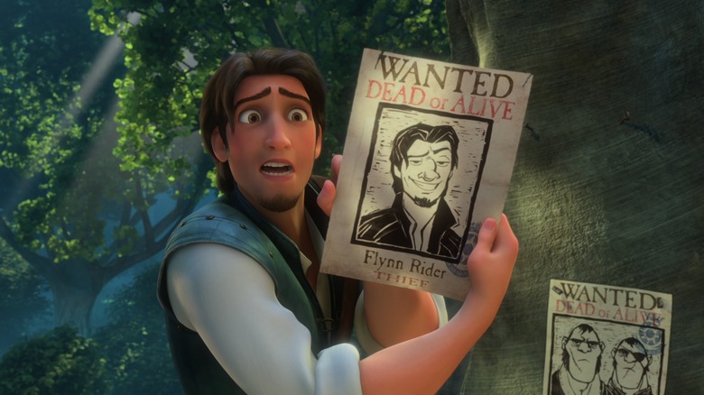 Flynn Rider holds poster