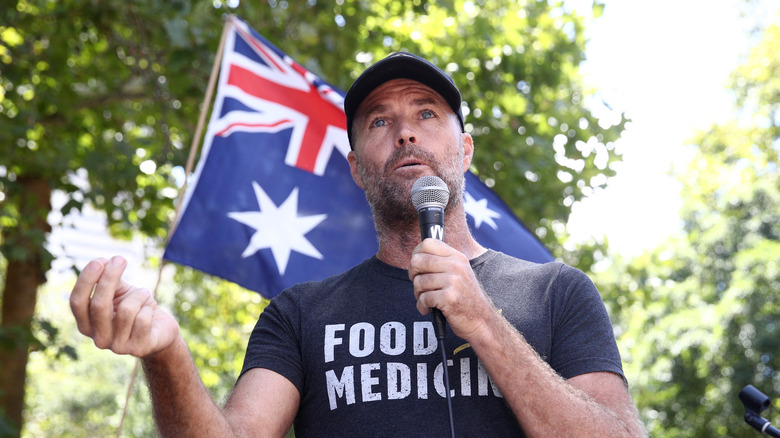 Pete Evans speaks into a mic