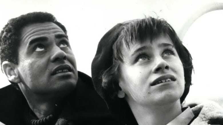 Rita Tushingham and Paul Danquah staring up