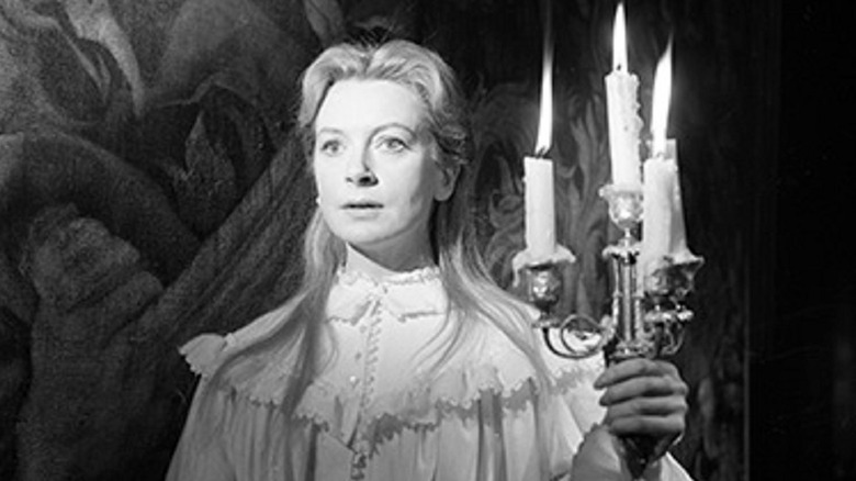 Deborah Kerr holding candles