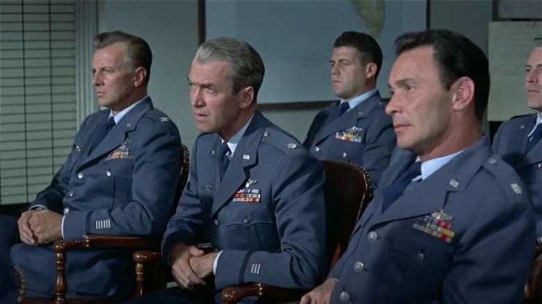 Robert R. "Dutch" Holland sitting with airmen