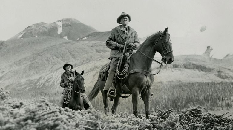 Ben Tatum and Jeff Webster riding horses