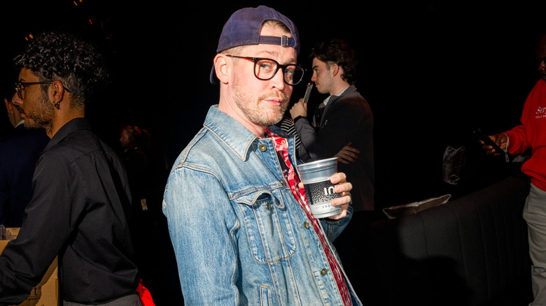 Macaulay Culkin with a cup at the premiere of Monday Night Raw on Netflix January 6, 2025 in Los Angeles