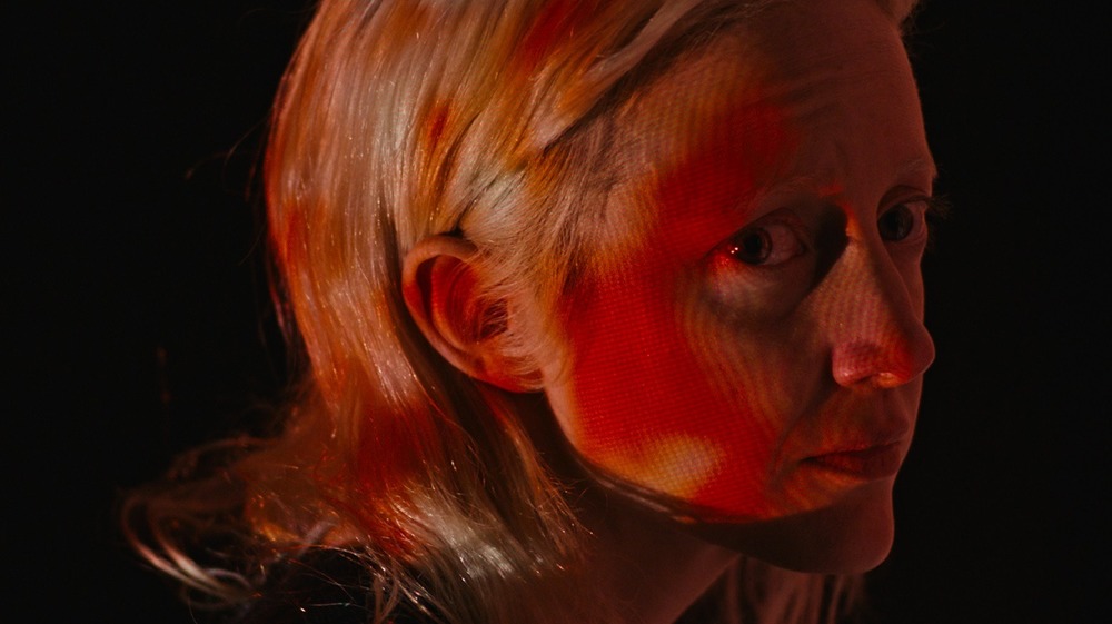 Andrea Riseborough in red light