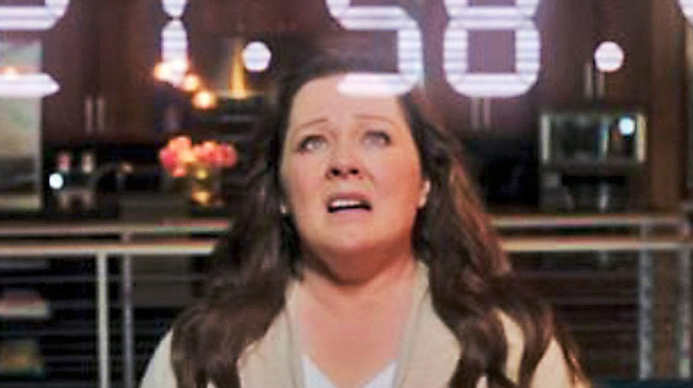 Melissa McCarthy looking at numbers