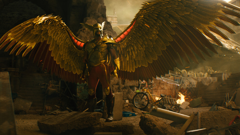 Hawkman spreads his wings in rubble