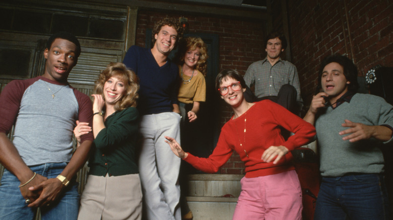 SNL cast of the 80s posing