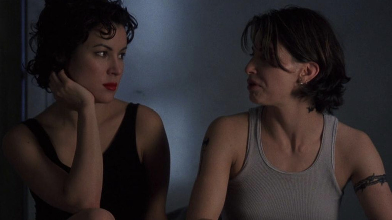 Jennifer Tilly and Gina Gershon look at each other