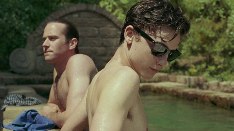 Elio and Oliver stand in pool