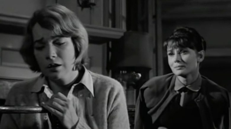 Audrey Hepburn gazes at upset Shirley MacLaine