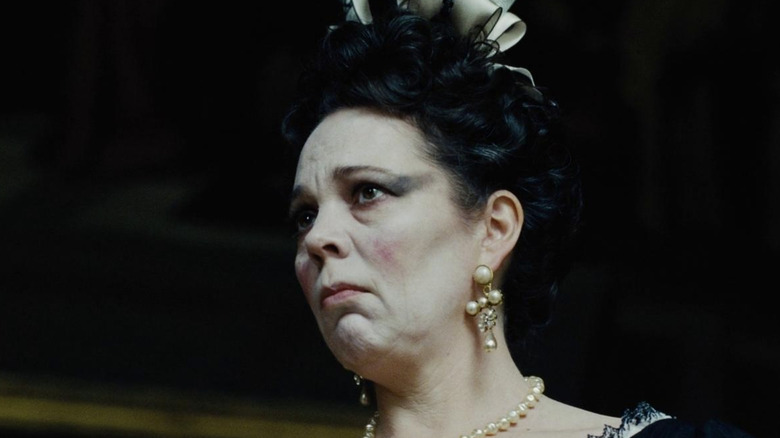 Olivia Colman looks up seriously