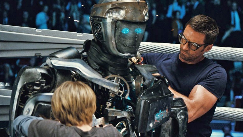 Hugh Jackman fixing a robot