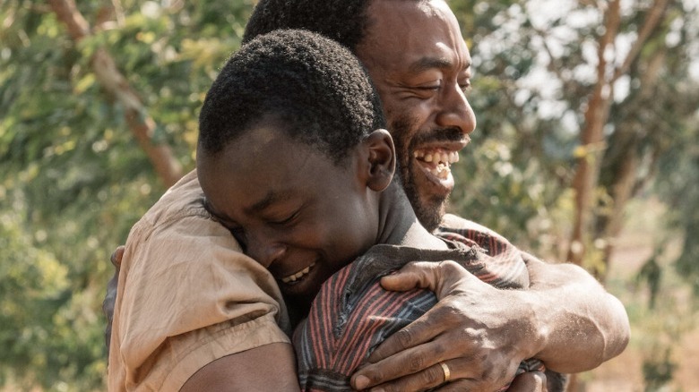 Chiwetel Ejiofor hugs young boy