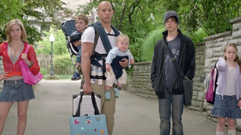 Vin Diesel carrying two babies