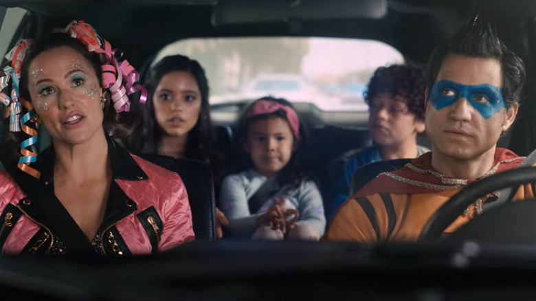 Family wears costumes in car