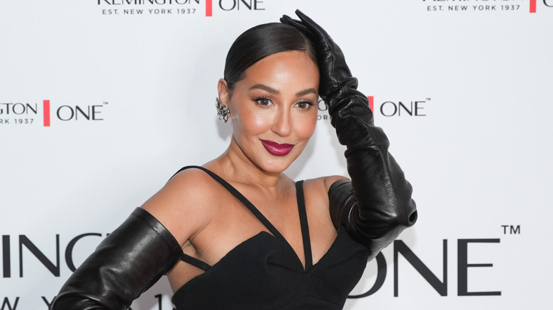 Adrienne Bailon walks the red carpet at a Remington One event