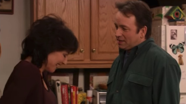 Katey Sagal and John Ritter laughing in 8 Simple Rules