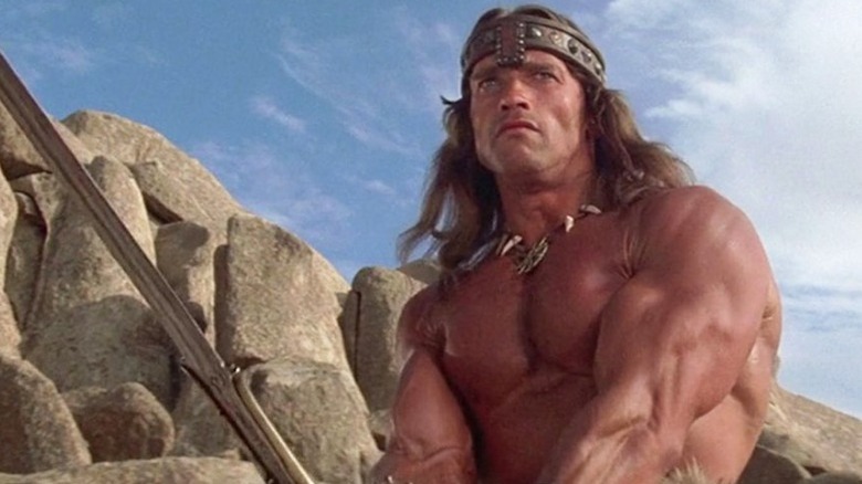 Arnold Schwarzenegger in Conan the Barbarian holding a sword