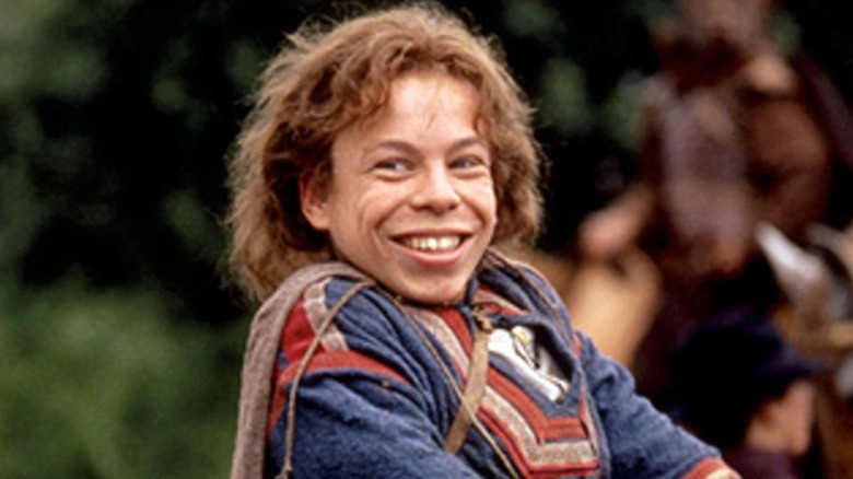 Warwick Davis smiling in Willow