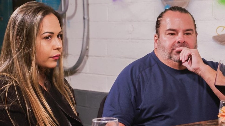 Big Ed Brown and Liz Woods sitting at a table together