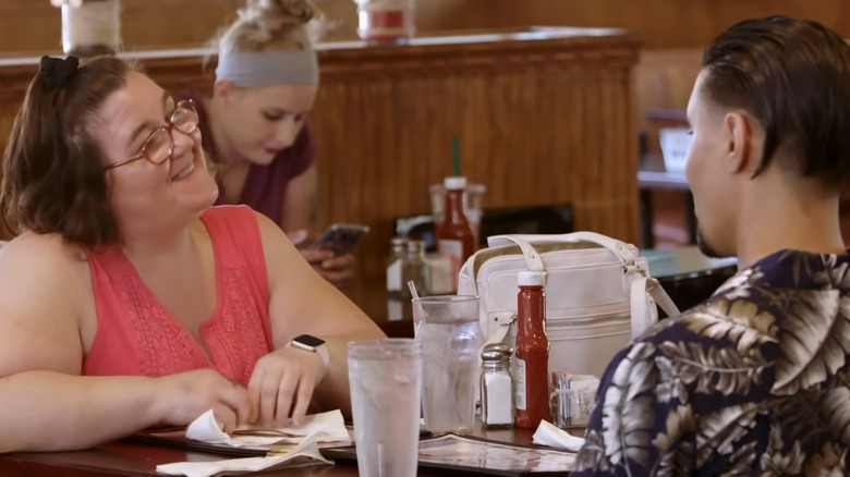 Danielle and Mohamed share a meal