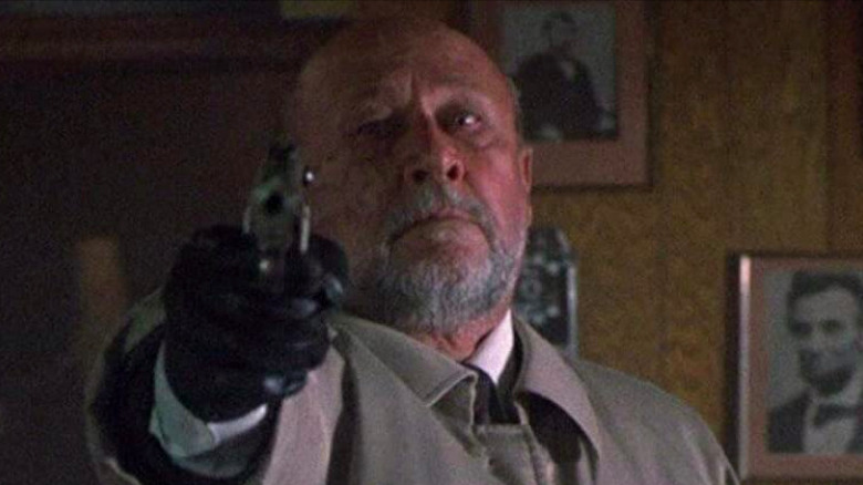 Donald Pleasance aiming gun