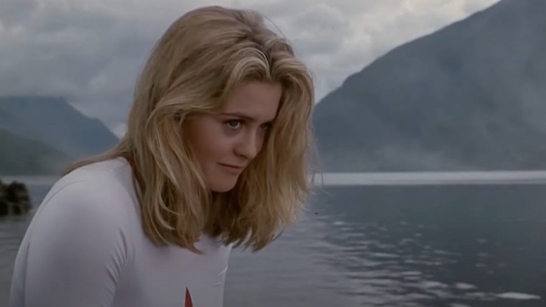 Alicia Silverstone smirks in "Excess Baggage"