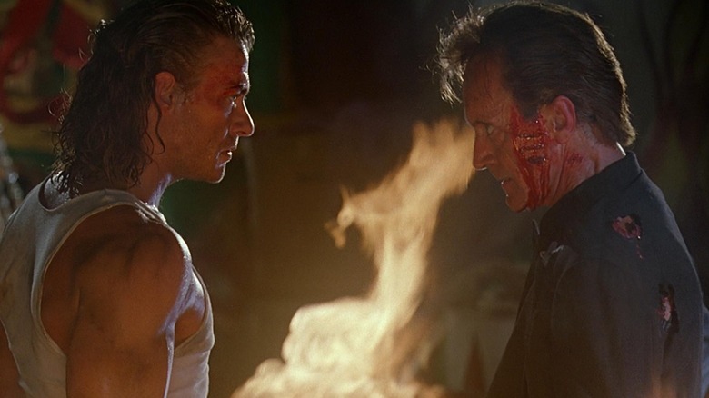 Chance Boudreaux contends with Emil Fouchon in "Hard Target" (1993)